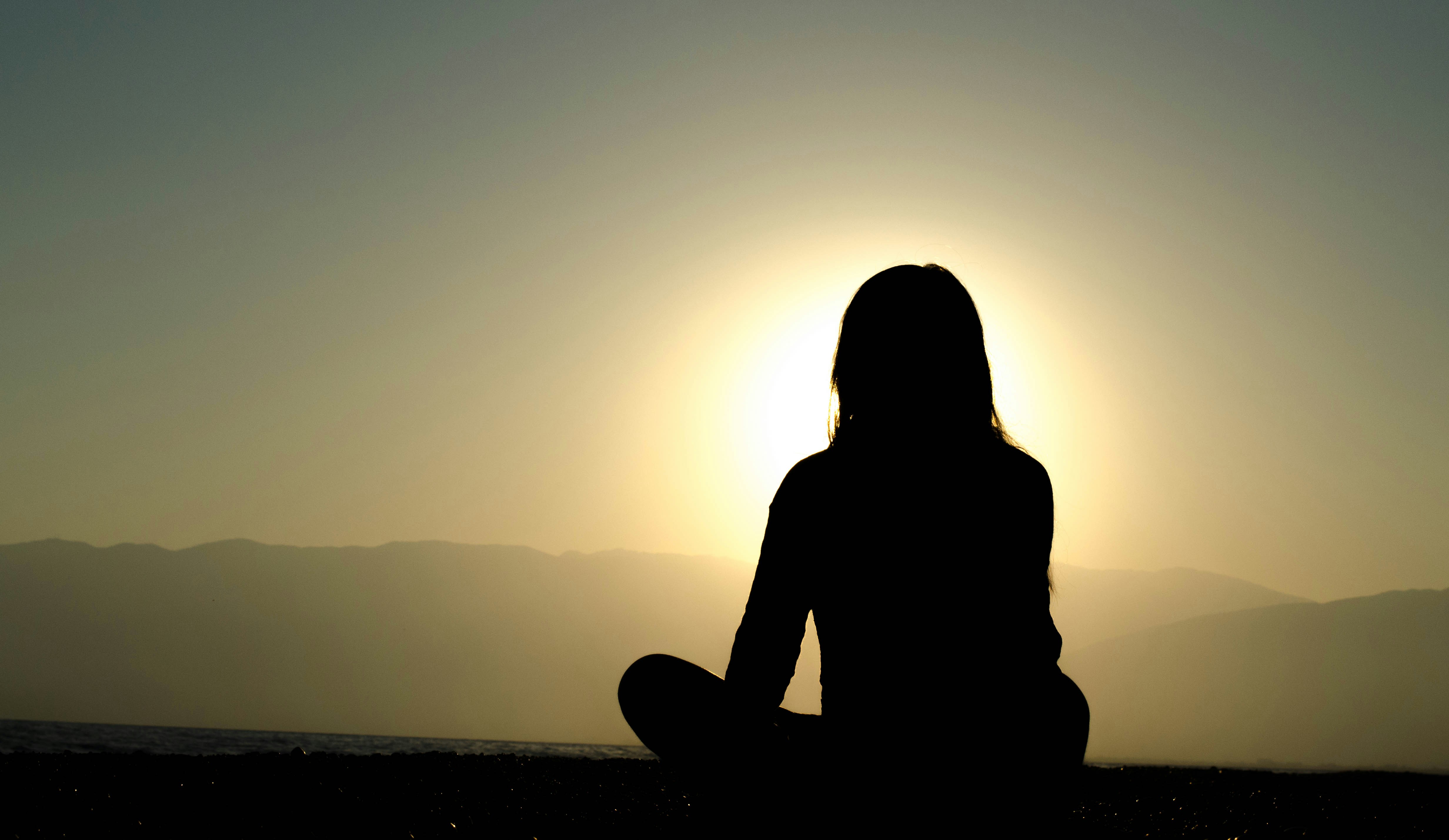 Person in meditation representing Human Design self-discovery